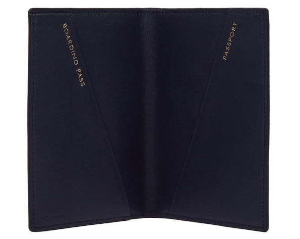 Smythson navy passport holder with 'Boarding Pass' and 'Passport' text at Pockets