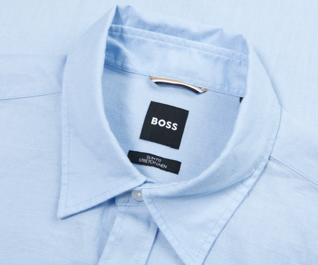 Light blue dress shirt with a Boss label on a light blue background