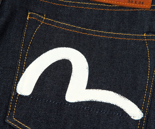 EVISU Off-White Seagull Carrot Fit Raw Denim Jeans Indigo
