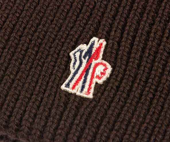 Close-up Moncler Grenoble brown wool beanie with small logo badge