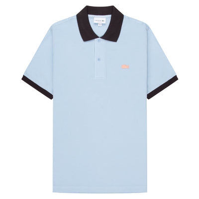 Lacoste Blue/Navy Trim Miami Blossom Polo in soft blue palette is anchored by navy contrast ribbing at the collar and cuffs