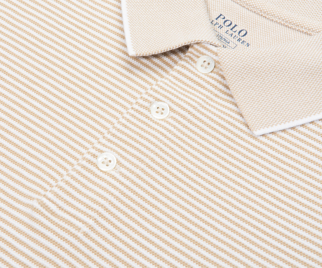 Close-up of a beige and white striped Polo Ralph Lauren shirt.