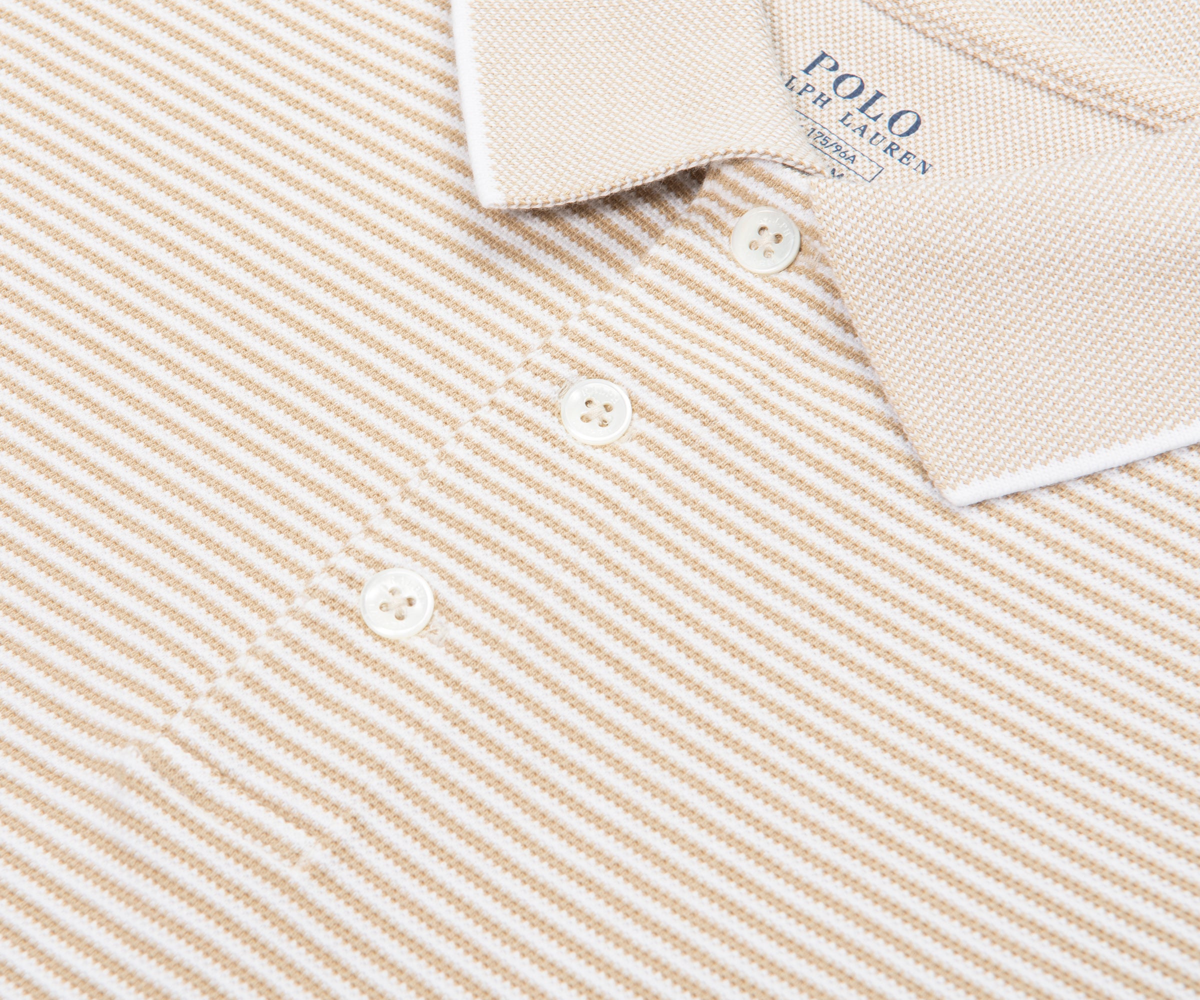 Close-up of a beige and white striped Polo Ralph Lauren shirt.