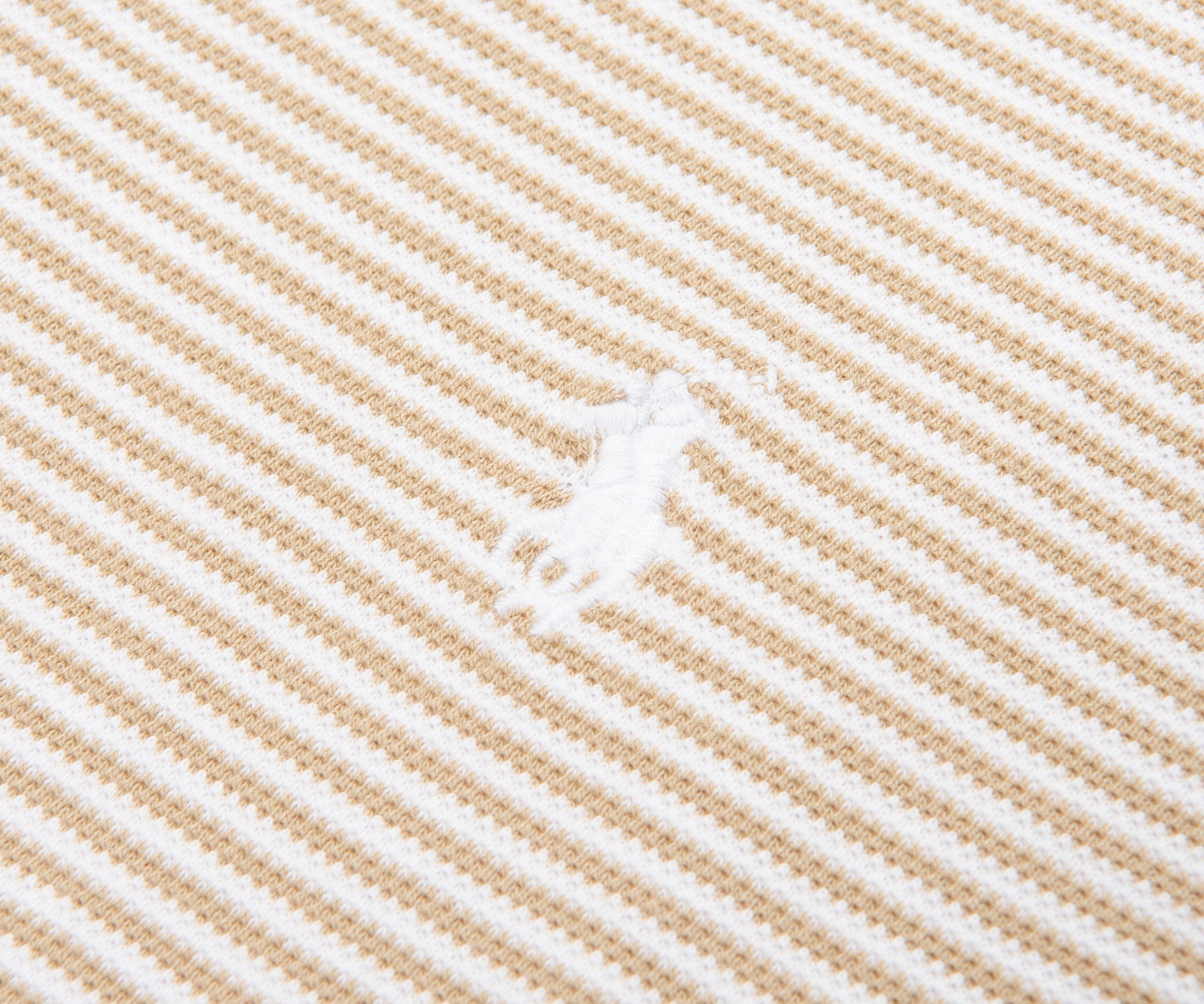Close-up of beige and white striped fabric texture