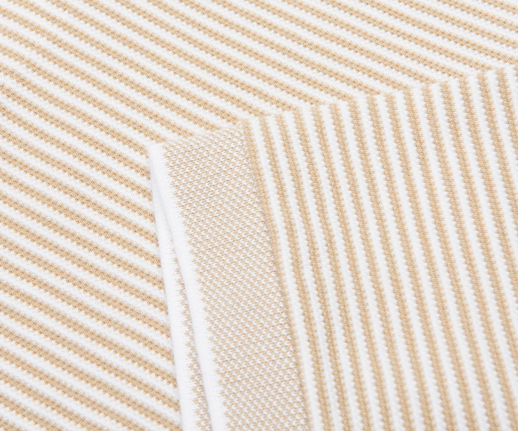 Close-up of beige and white striped fabric texture
