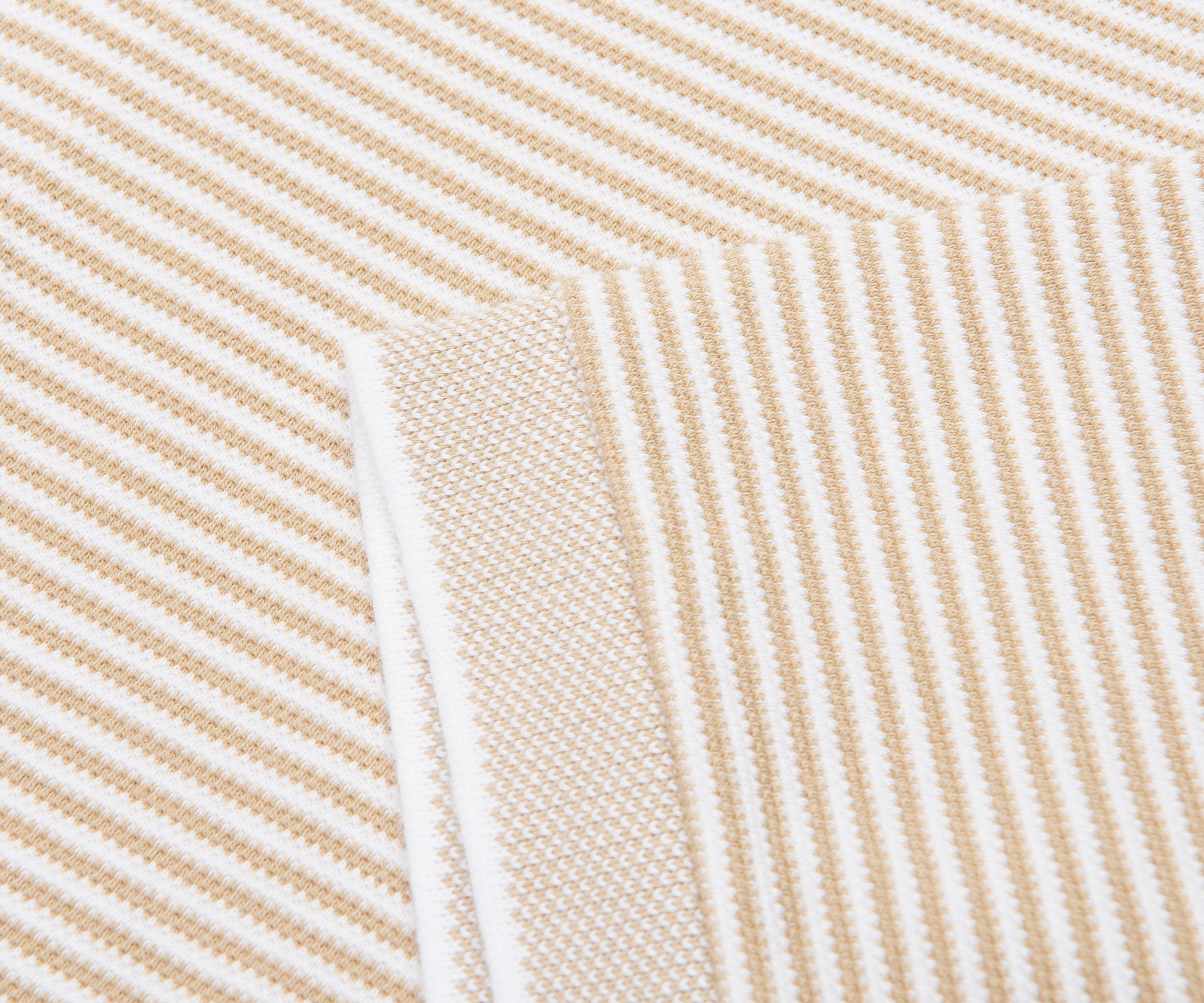 Close-up of beige and white striped fabric texture