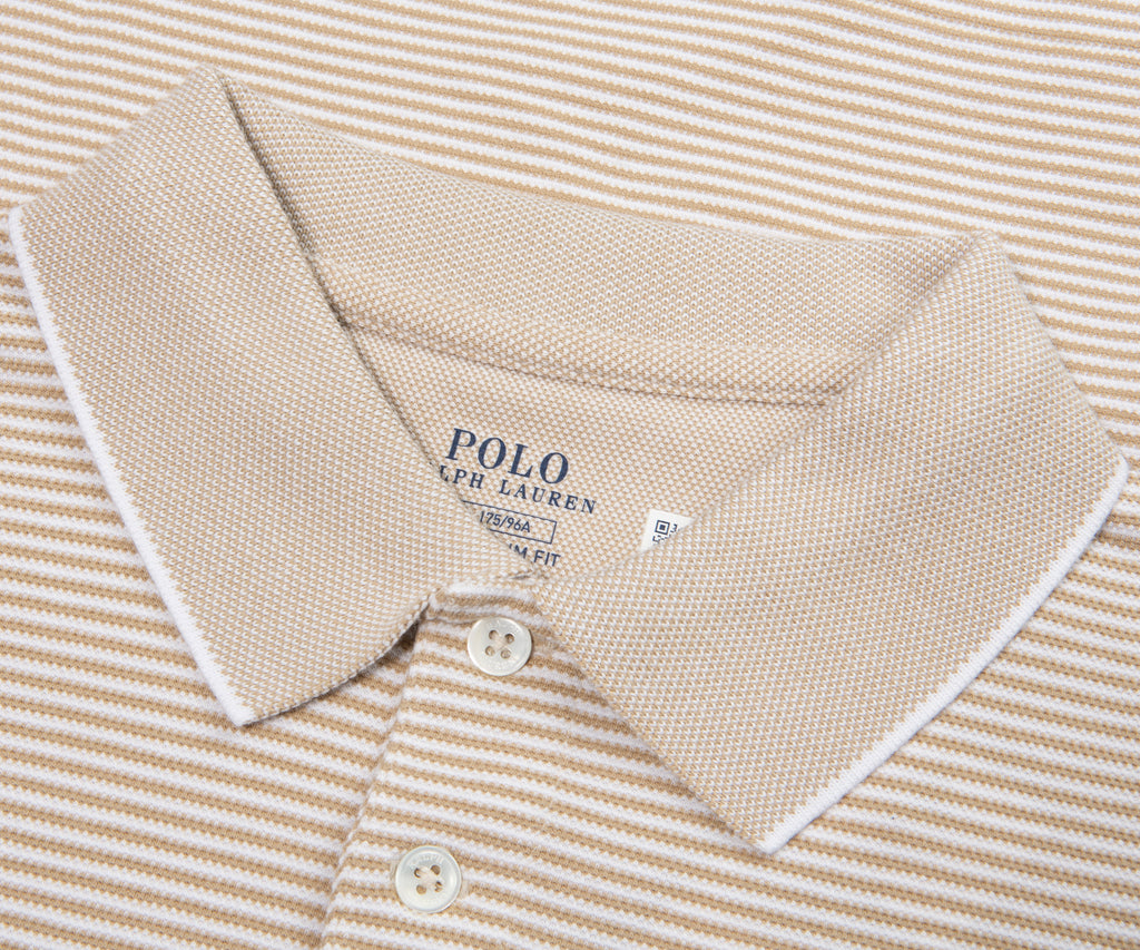 Beige and white striped polo shirt with Polo Ralph Lauren logo on a matching background