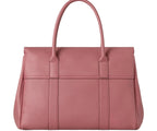 Pink handbag on a light gray background