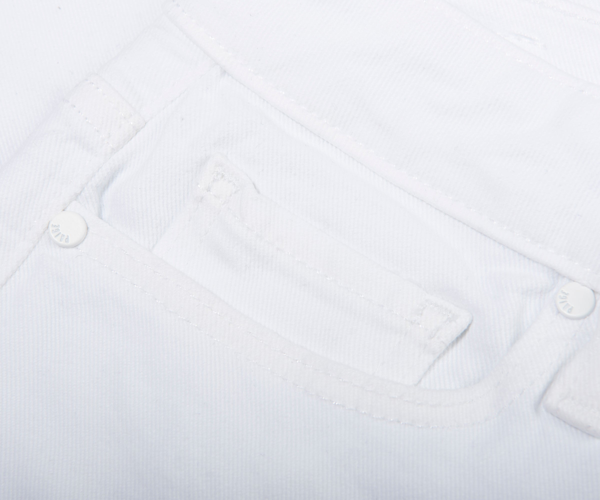 Close-up of a white shirt with collar and buttons