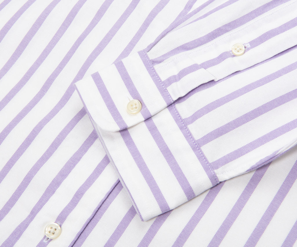 Close-up of a folded purple and white striped shirt