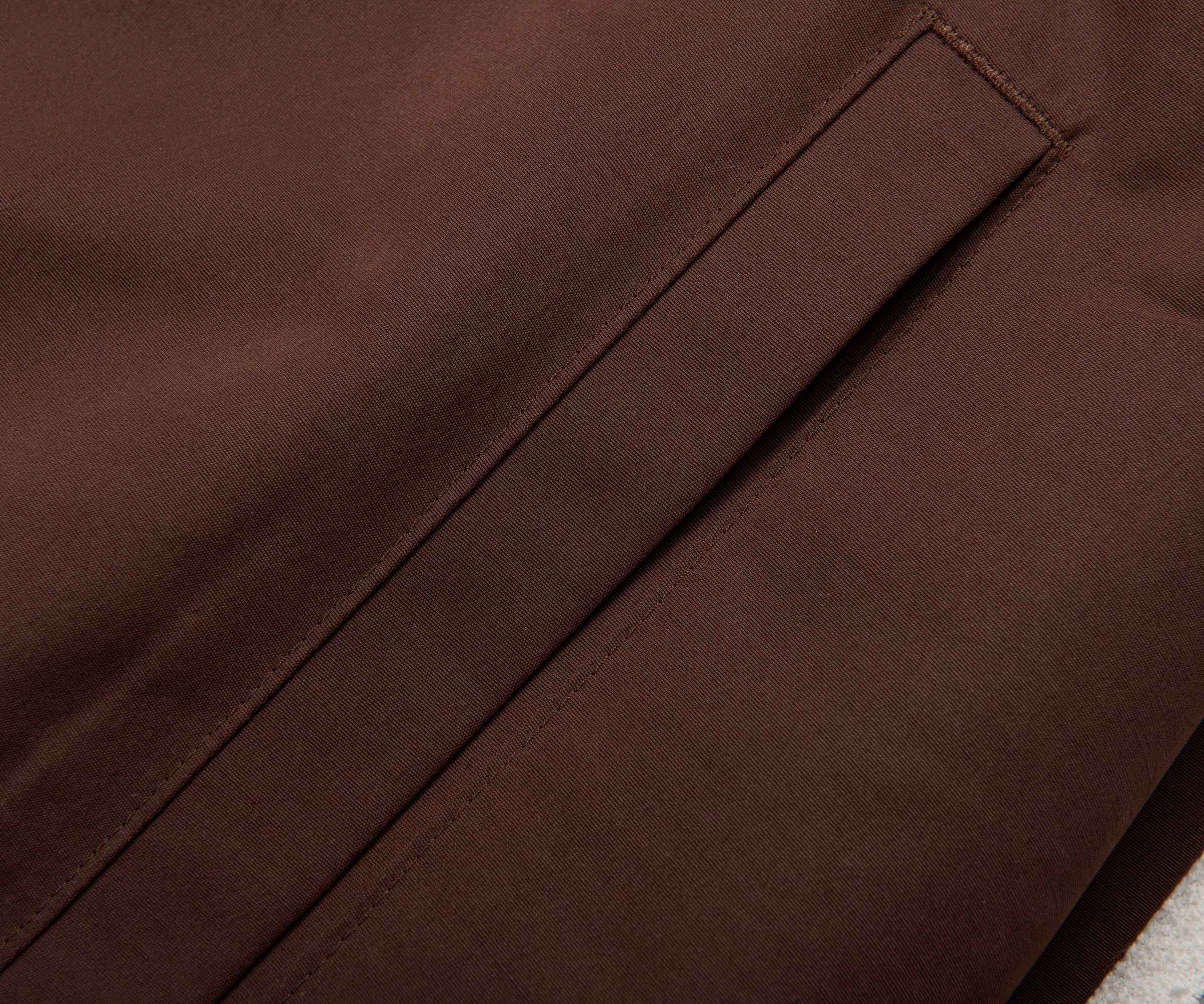 Close-up of brown fabric with a seam