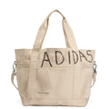 Beige tote bag with 'Adidas' branding on a white background