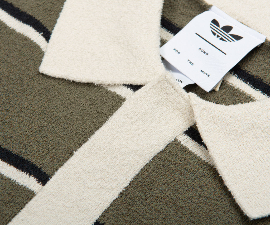 Textile product with Adidas label on a geometric patterned background