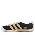 Black and beige Adidas sneaker with three stripes on a white background