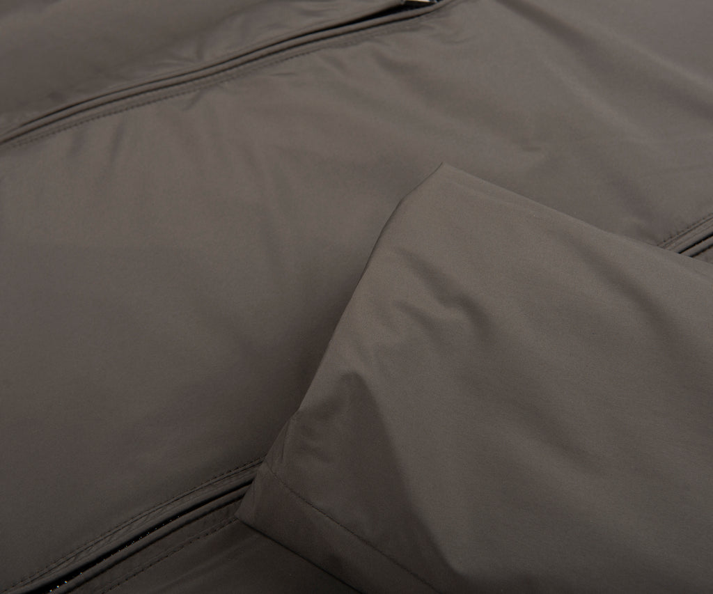 Close-up of a gray fabric surface with a zipper