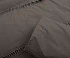 Close-up of a gray fabric surface with a zipper