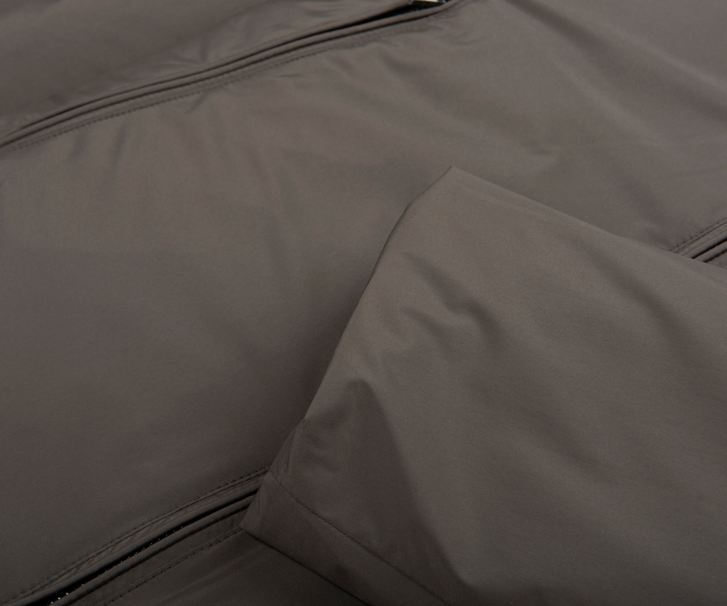 Close-up of a gray fabric surface with a zipper