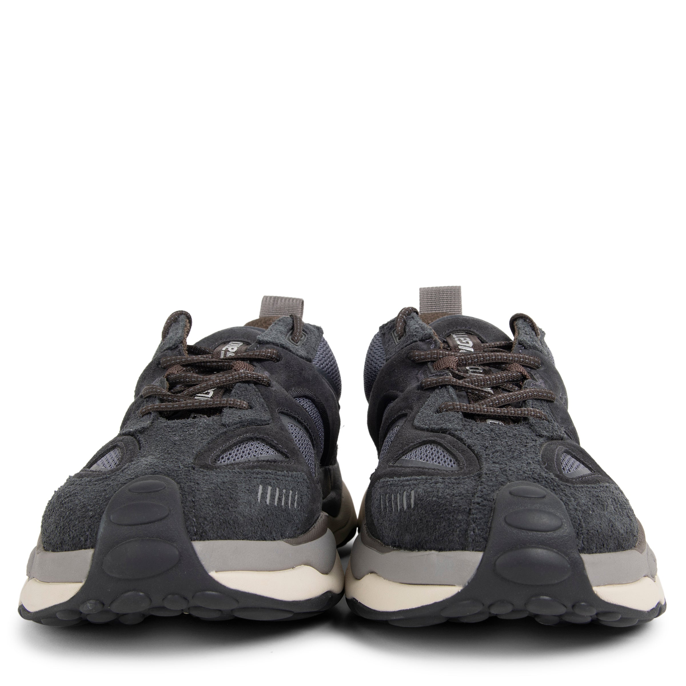 Pair of dark gray sneakers with white soles on a white background