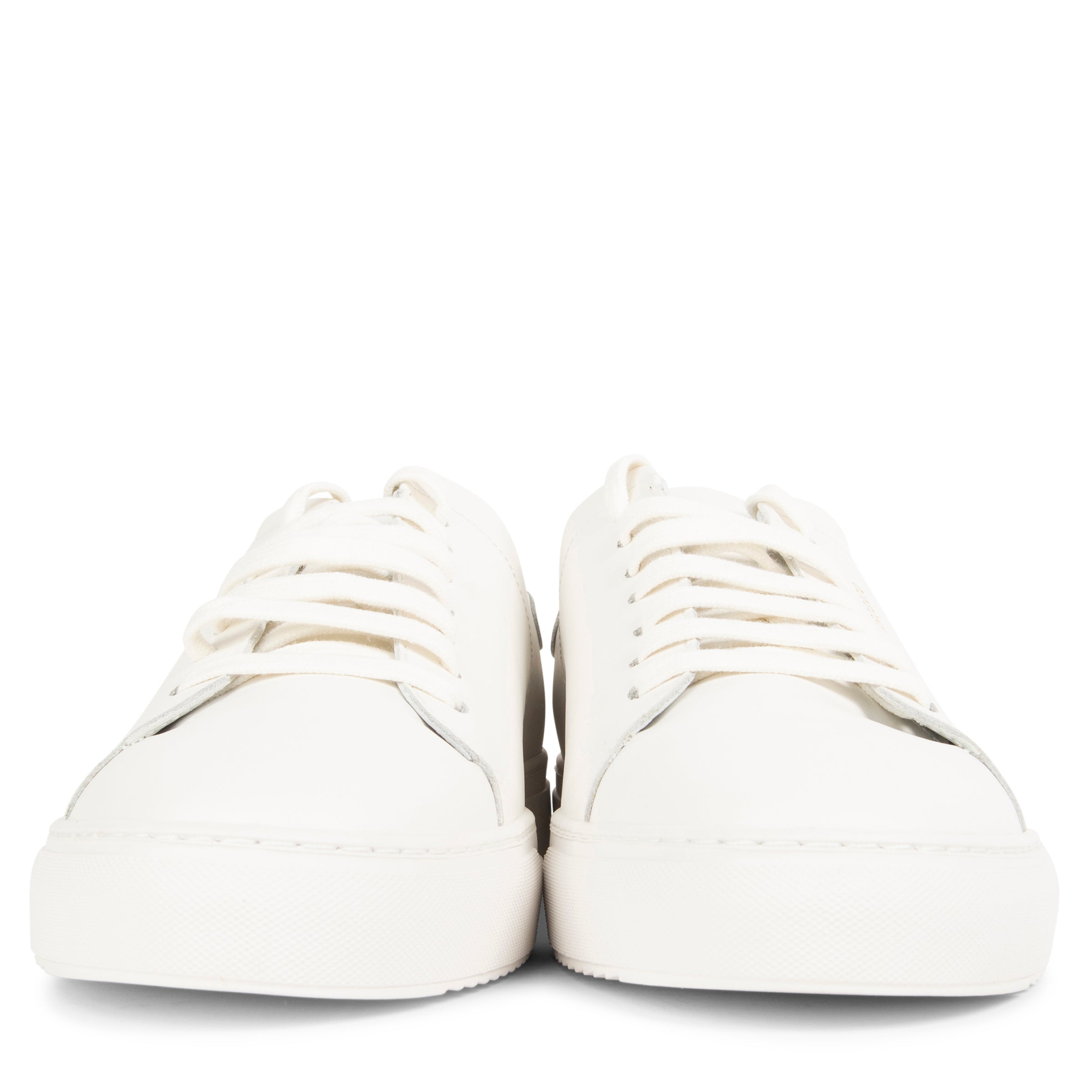 Pair of white sneakers on a white background