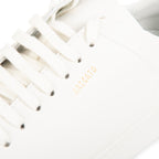 Close-up of a white woven basket with 'Santoro' branding on a light background