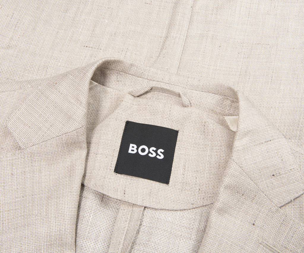Light gray suit jacket with 'BOSS' label on a matching fabric background