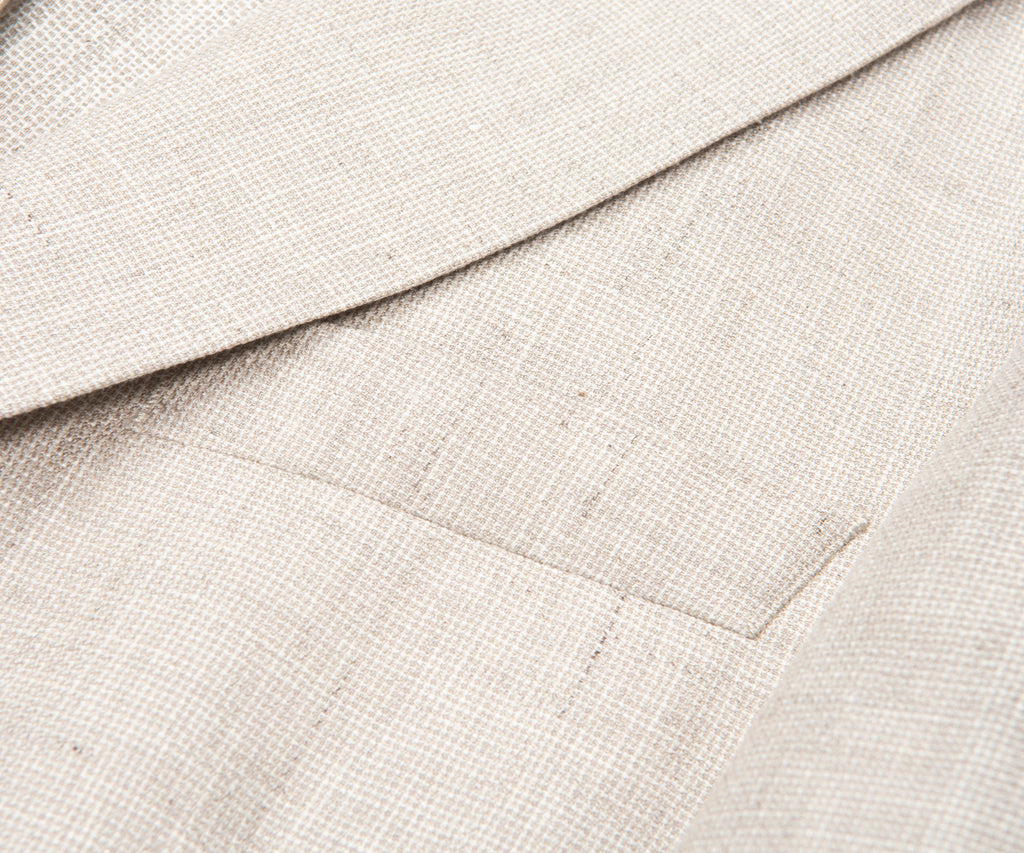 Close-up of beige fabric with a textured pattern