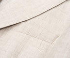 Close-up of beige fabric with a textured pattern