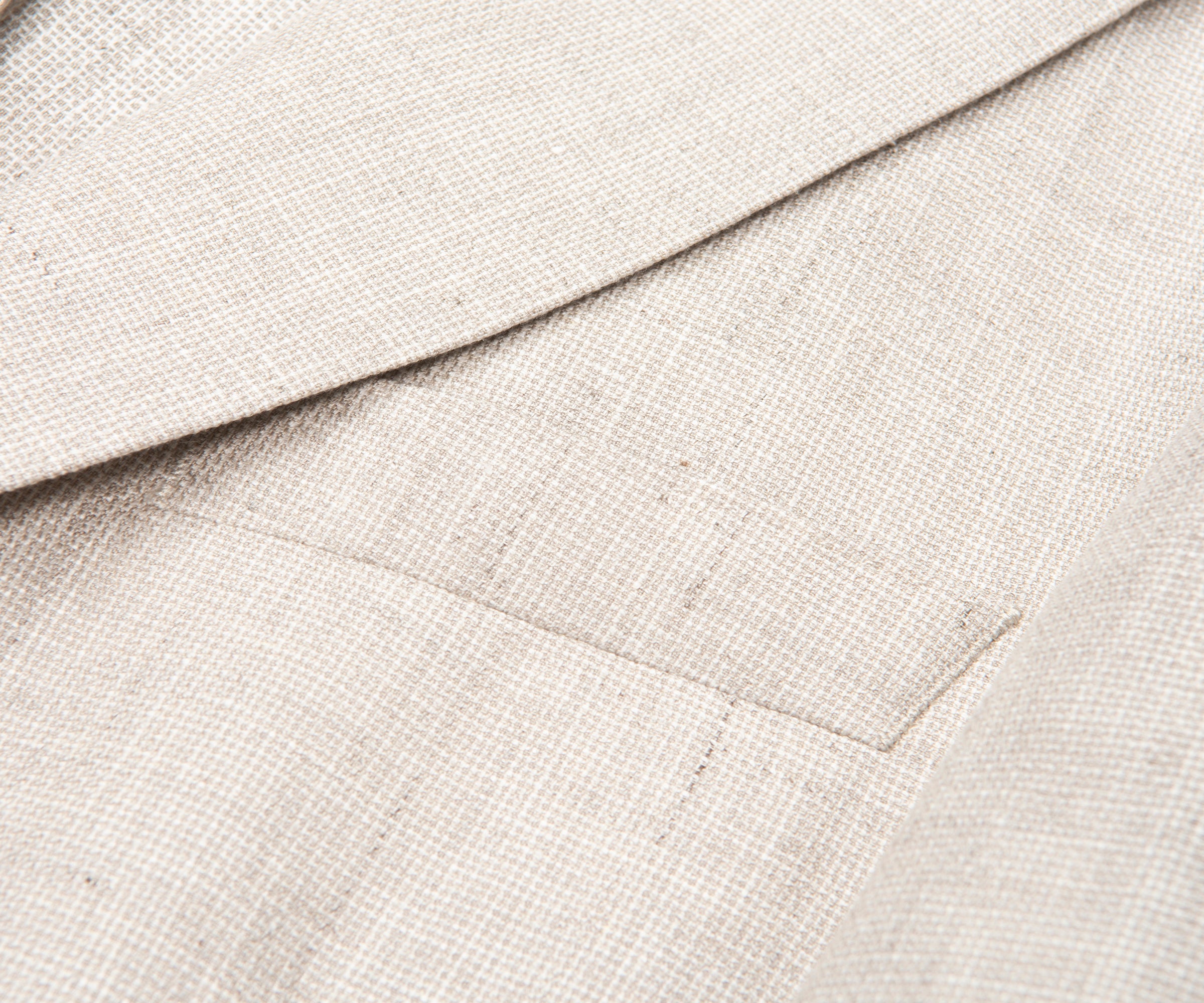 Close-up of beige fabric with a textured pattern