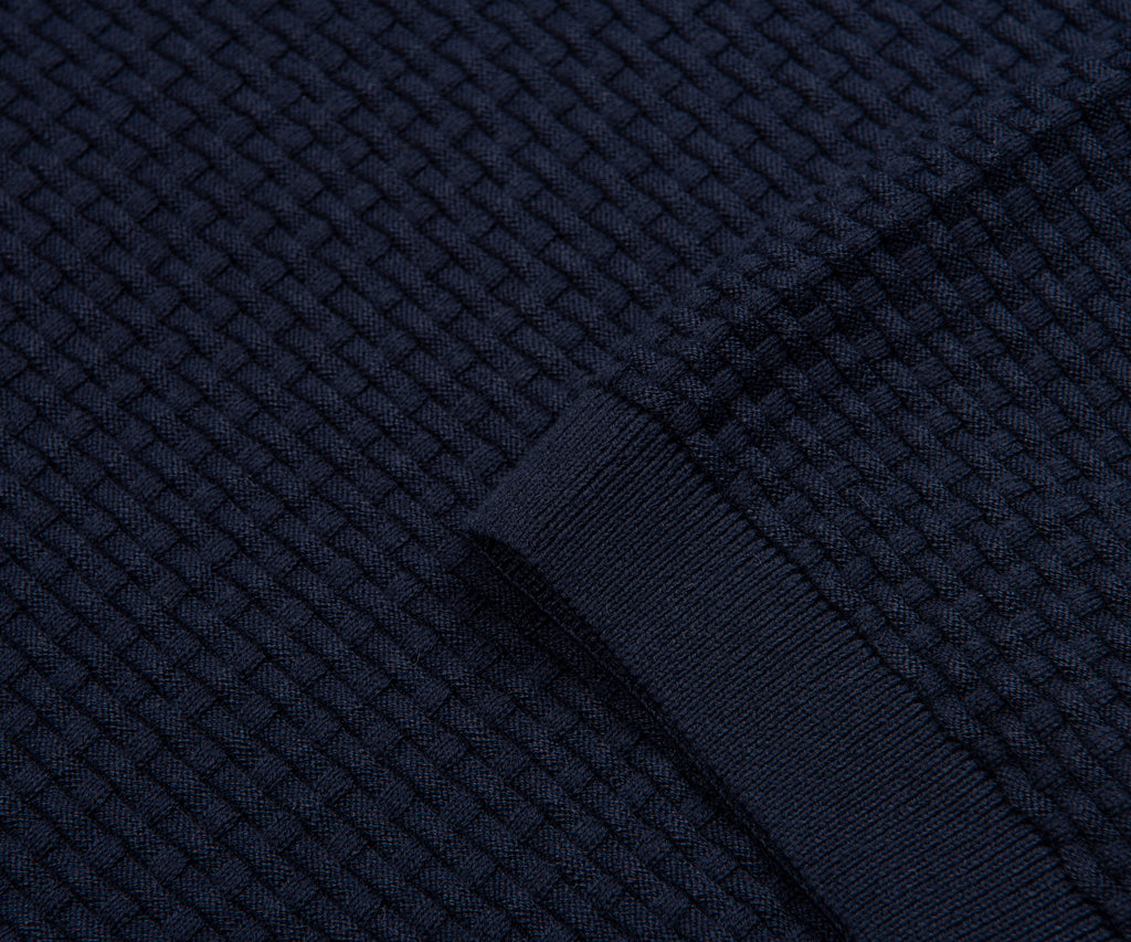 Close-up of dark blue textured fabric with a woven pattern