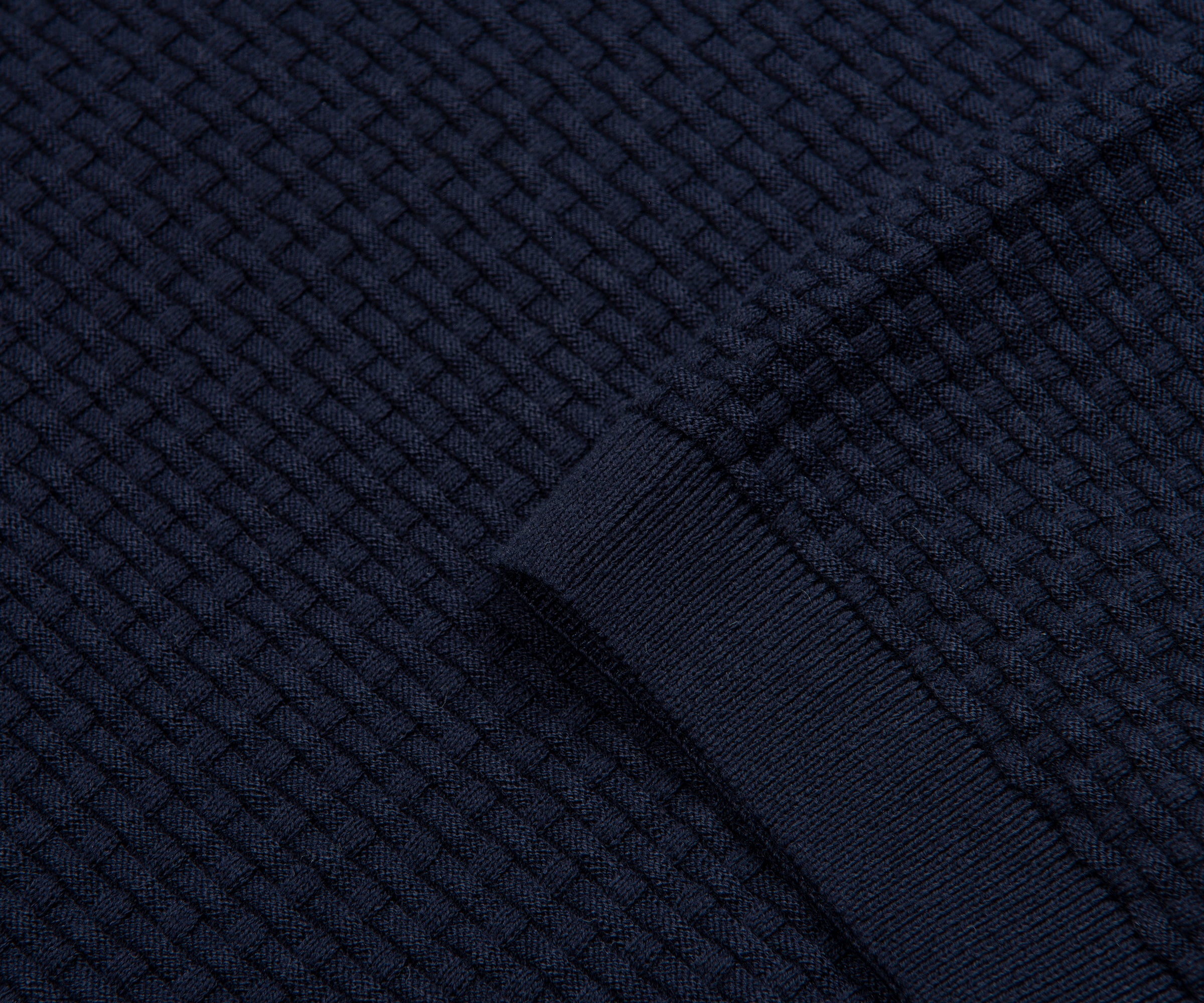 Close-up of dark blue textured fabric with a woven pattern