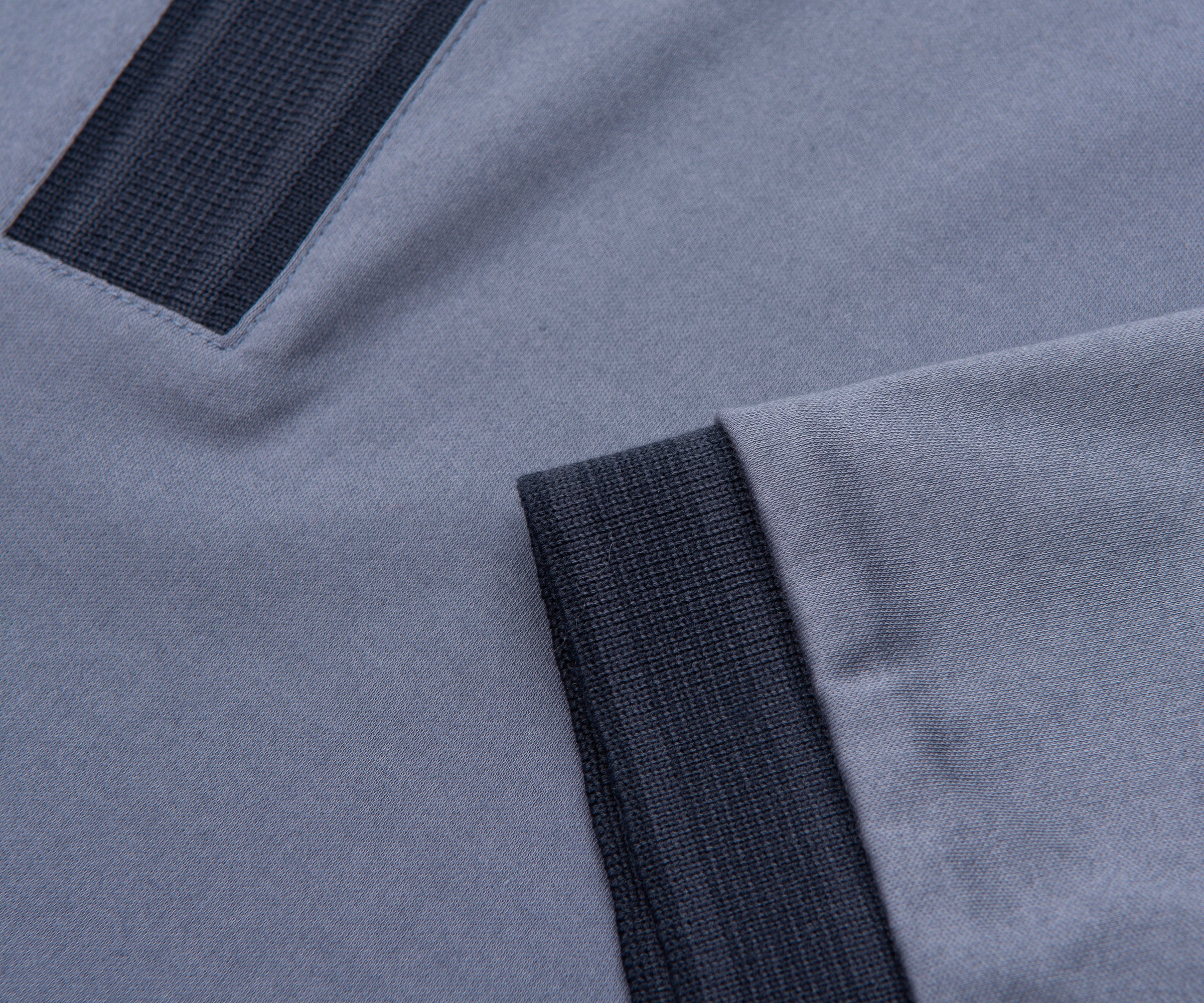 Close-up of gray fabric with black elastic trim