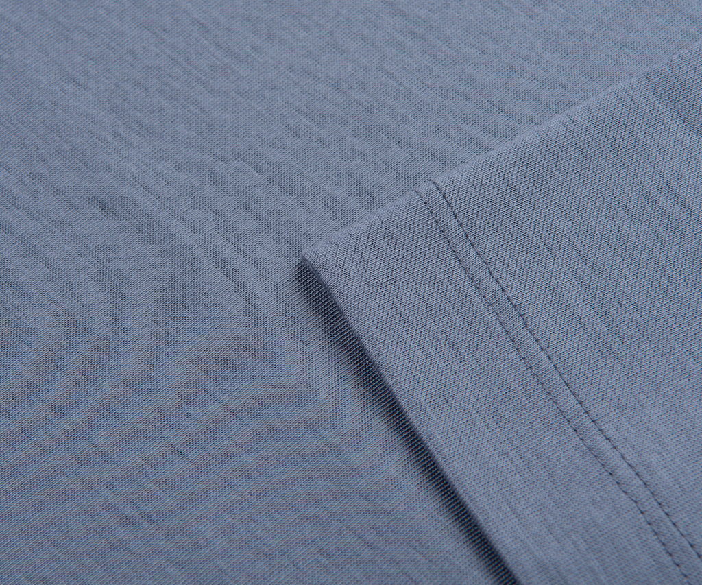 Close-up of blue fabric with a folded edge