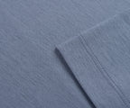 Close-up of blue fabric with a folded edge