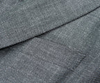 Close-up of gray textured fabric with a diagonal seam