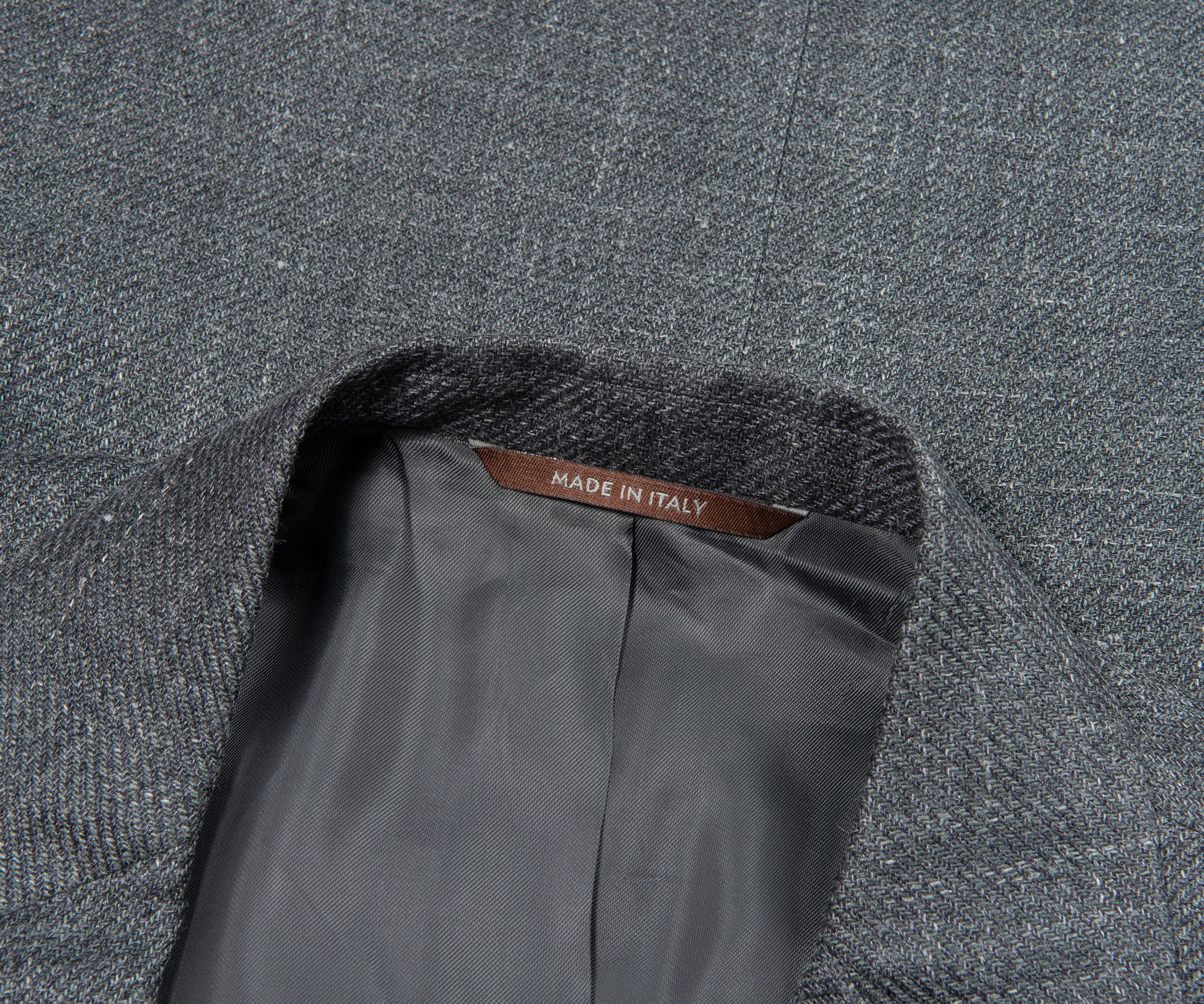 Gray textured fabric with 'Made in Italy' label