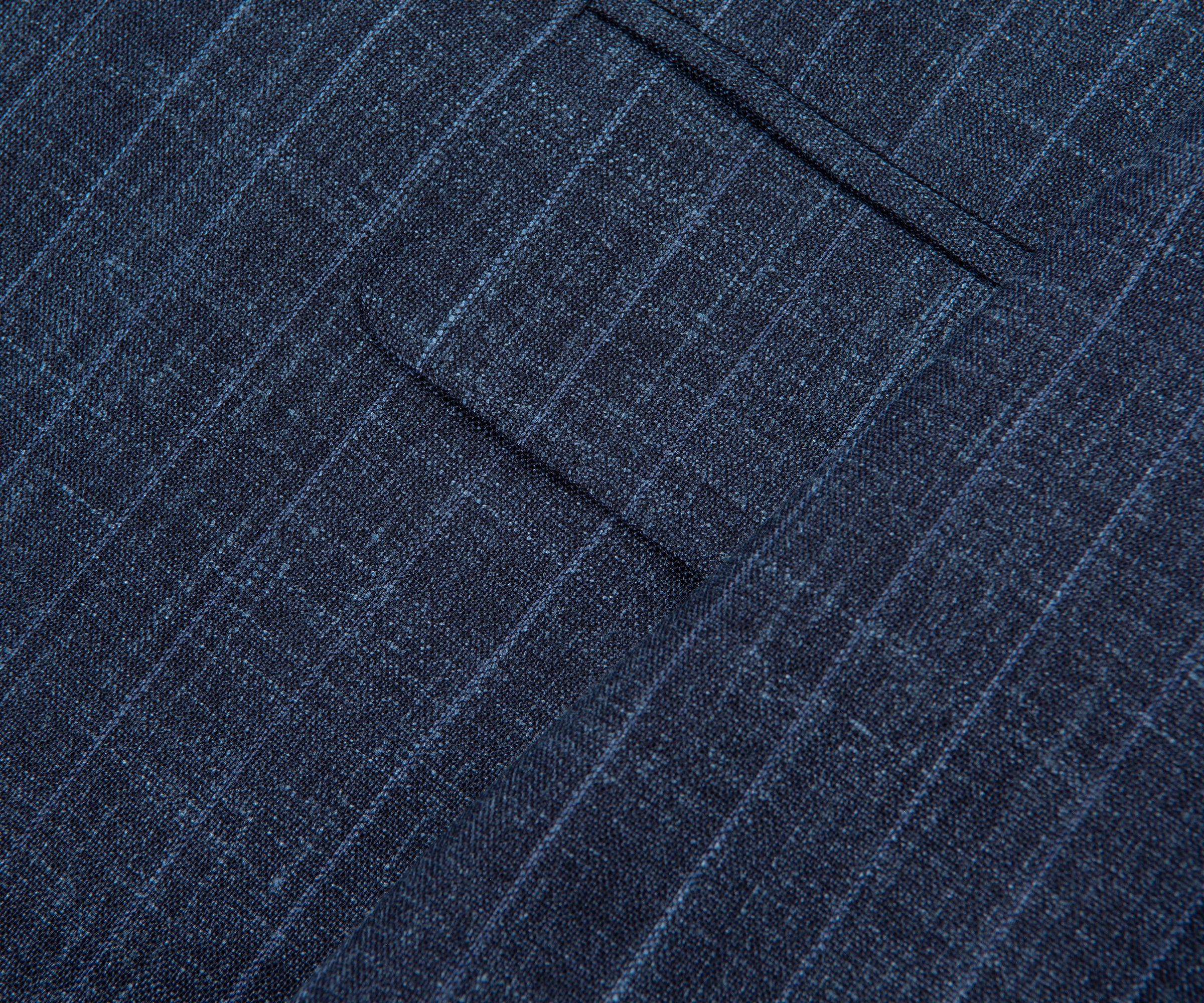 Close-up of a blue pinstripe suit pocket