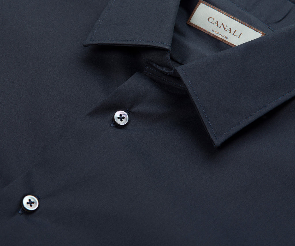 Dark blue shirt with a Canali label on a dark background