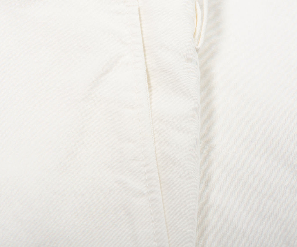 Close-up of a white fabric texture with a subtle pattern