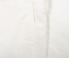 Close-up of a white fabric texture with a subtle pattern