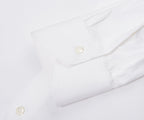 Close-up of a white shirt with buttons on a white background