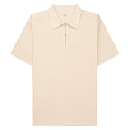 Beige polo shirt with a quarter zip on a white background