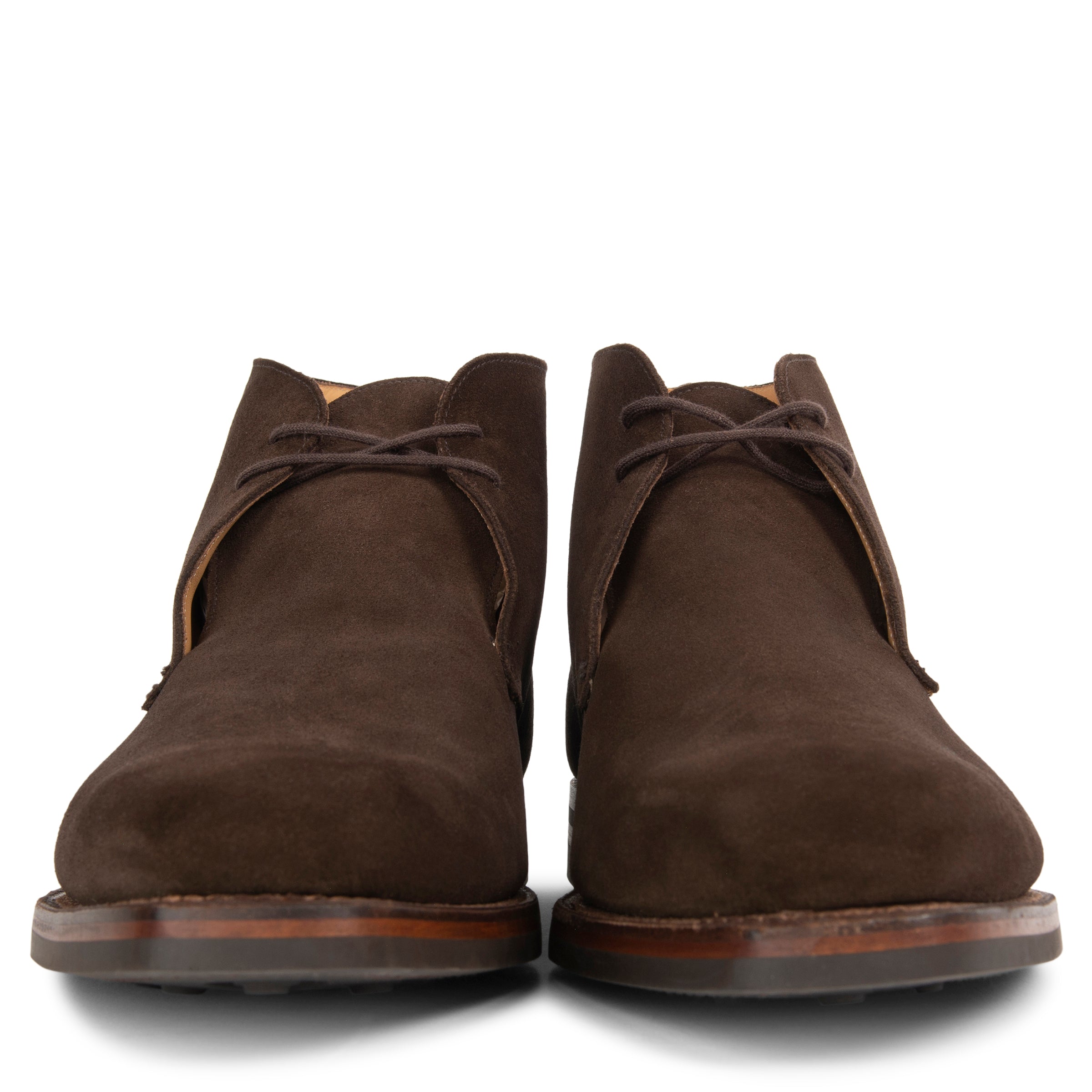 Pair of brown suede boots on a white background