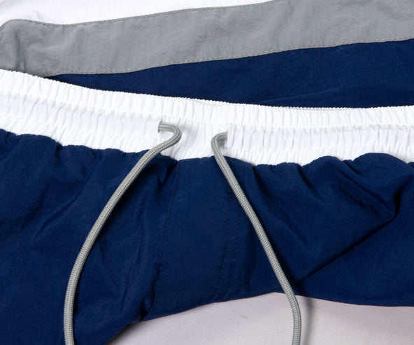 BRUNELLO CUCINELLI Paneled Striped Swim Shorts Blue