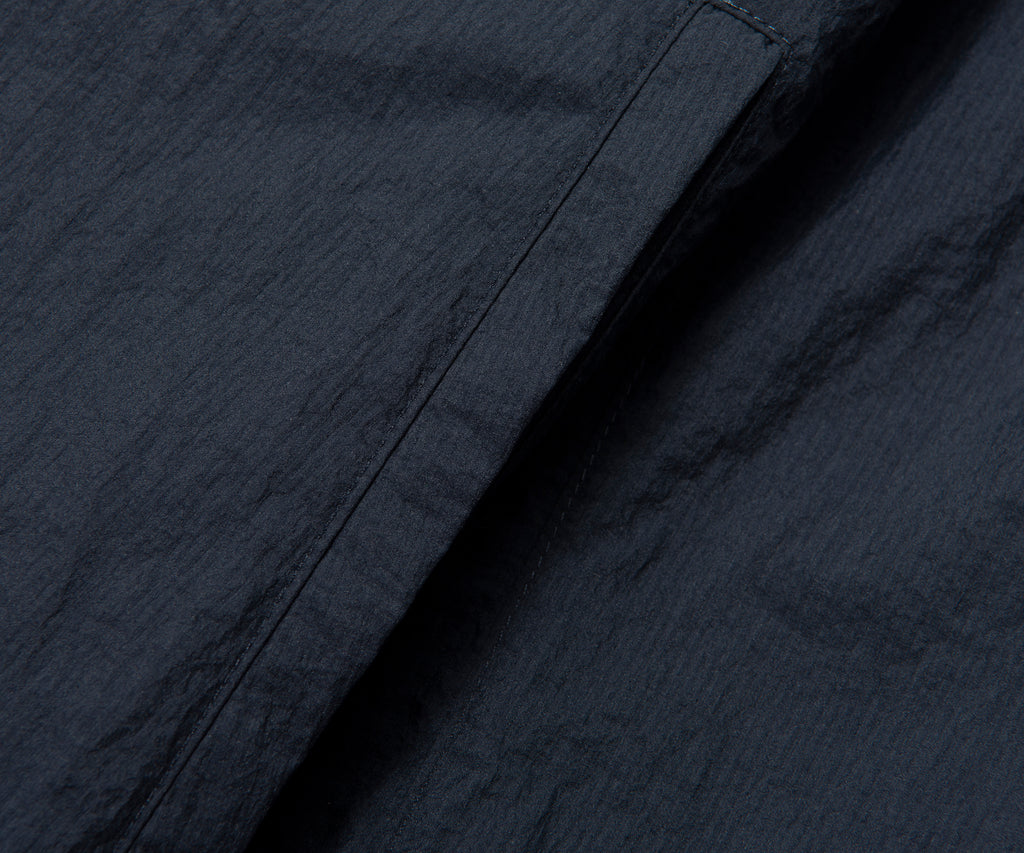 Close-up of dark blue fabric with visible texture