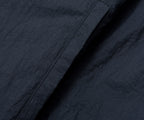 Close-up of dark blue fabric with visible texture