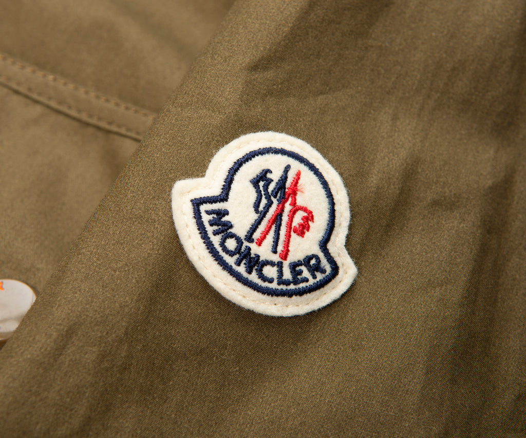 Moncler logo patch on a brown jacket