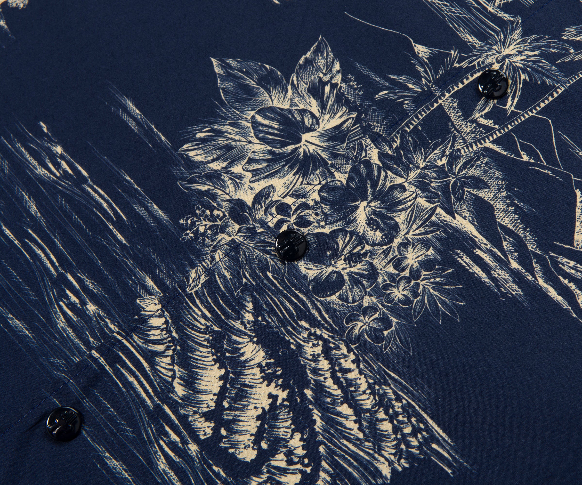 Close-up of engraved floral design on a dark surface