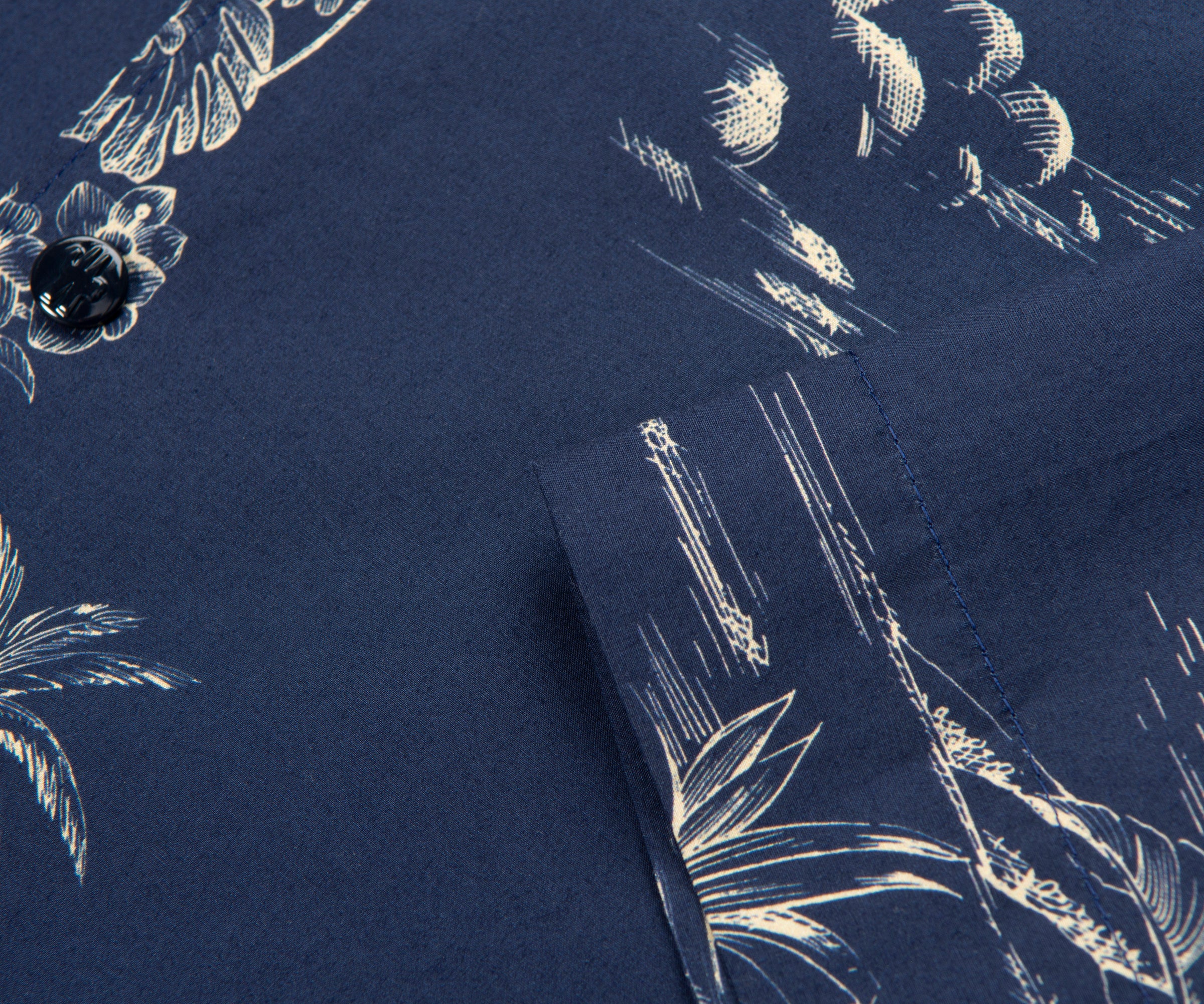 Navy blue fabric with white floral embroidery