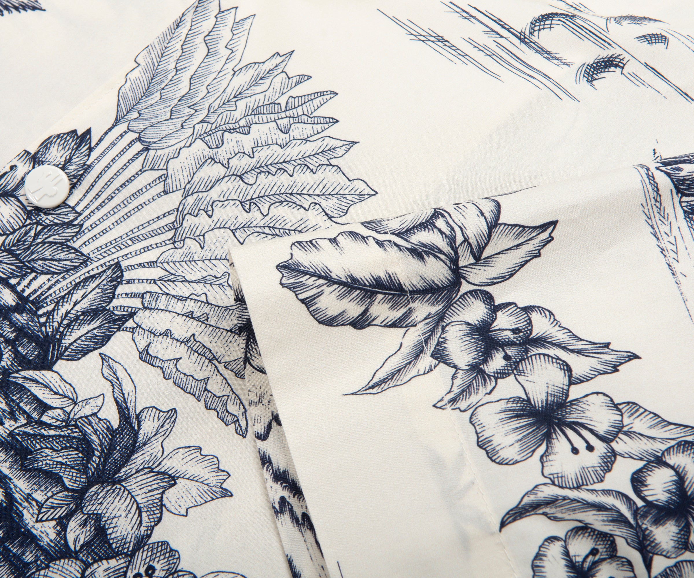 White fabric with black floral and leaf patterns
