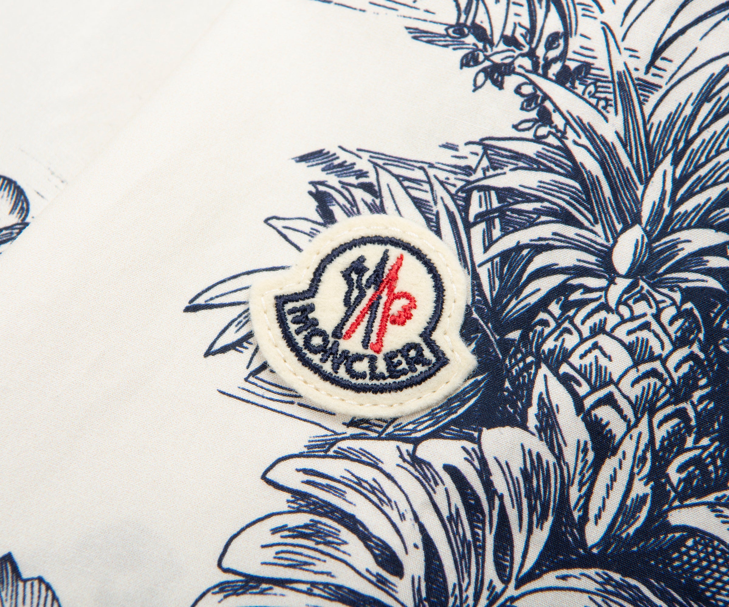 Moncler logo on a fabric with pineapple pattern